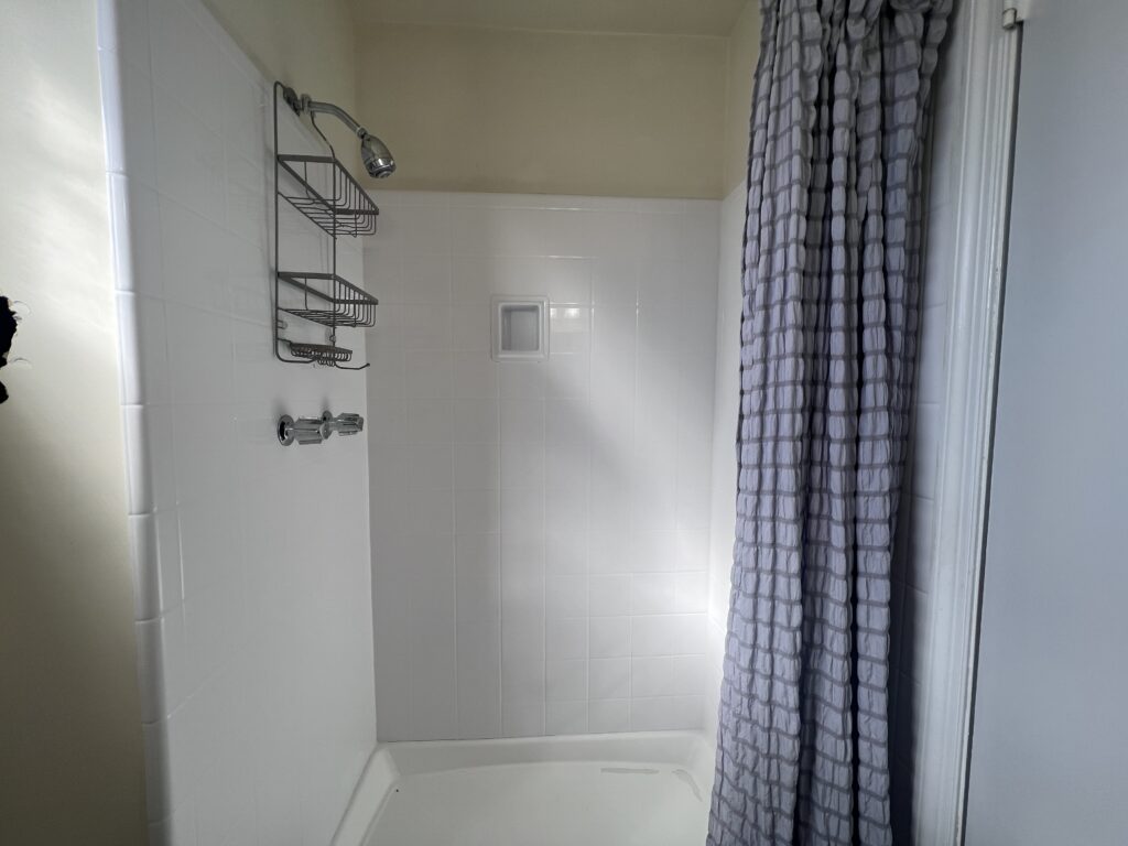 Master Bath before renovation. Small and white